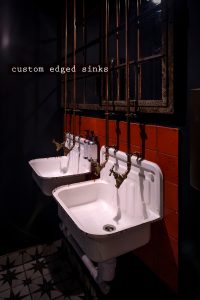kricket-soho-london-bar-restaurant-design-interiors-bathroom-toilets-sinks-custom-captioion