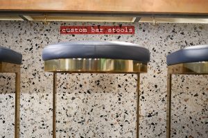 kricket-soho-london-bar-restaurant-design-interiors-custom-bar-stools-caption