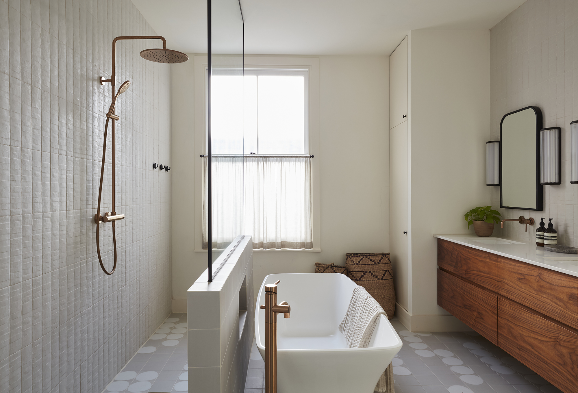 airy bathroom with stylized tub and shower