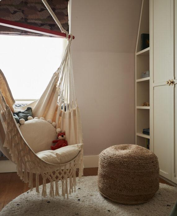 kids bedroom with pouffe and fabric swing hammock