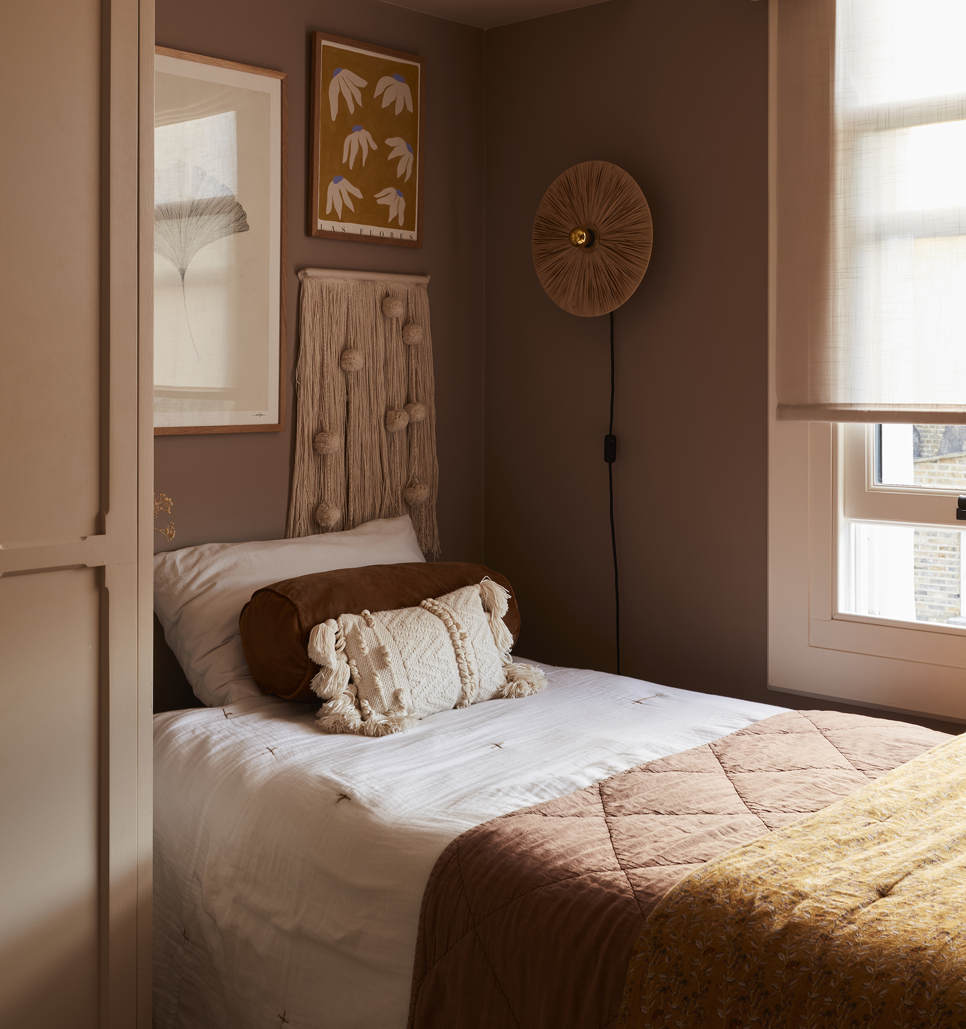cozy kids bedroom, terracotta and pink themed colours by a cute window