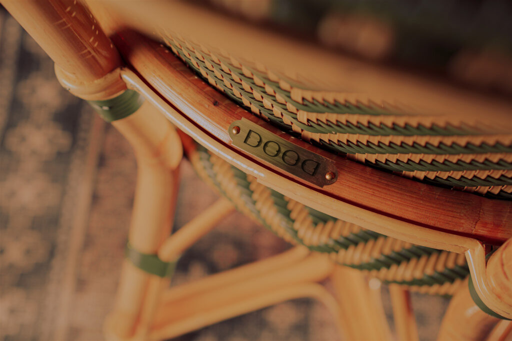 Dood custom dining chairs with a small logo plaque